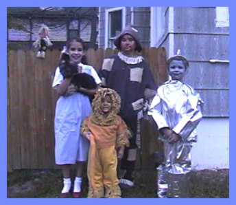 Family in the Wizard of Oz character costumes